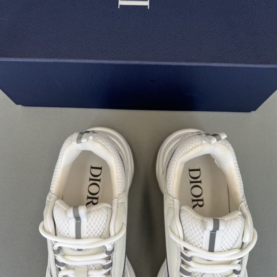 Dior B22 Trainers Insole and Tongue Detail in white and silver Close-up top view of Dior B22 trainer collars, tongues and printed insoles in white and silver