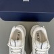 Dior B22 Trainers Insole and Tongue Detail in white and silver Close-up top view of Dior B22 trainer collars, tongues and printed insoles in white and silver
