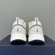 Dior B22 Trainers Heel View in white and silver Rear view of Dior B22 white trainers displaying heel pull tabs and padded collars in white and silver