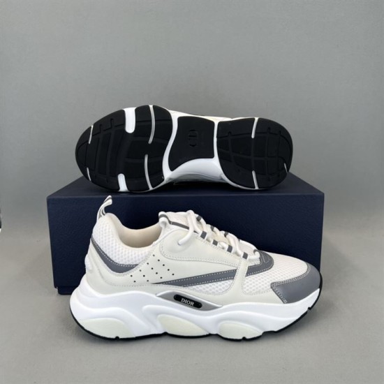 Dior B22 Trainer Side Profile and Outsole in white and silver Dior B22 trainer side view shown alongside treaded black outsole in white and silver
