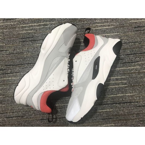 Close-up view of lateral mesh and leather panels on Dior B22 Trainers in white and grey