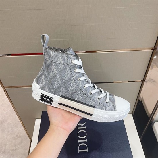 Dior B23 Grey High-Top Trainer Handheld Hand holding Dior B23 high-top grey patterned trainer side profile