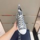 Dior B23 Grey Trainer Top-Down View Top-down view of Dior B23 grey patterned trainer held in hand