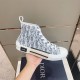 Dior B23 High Top Blue Oblique Trainer Handheld View Hand holding Dior B23 High Top Blue Monogram Trainer side profile