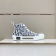 Dior B23 High-Top Canvas Trainers Display View in black and white Side view of Dior B23 High-Top Canvas Trainers In Black And White on display