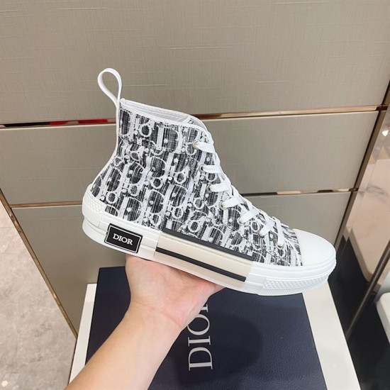 Dior B23 High-Top Canvas Trainers Handheld Side View in black and white Handheld side profile view of Dior B23 High-Top Canvas Trainers In Black And White
