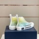 Dior B23 High-Top Trainers Heel View in green and yellow Rear view of Dior B23 high-top trainers featuring white heel tab and side branding patch in green and yellow