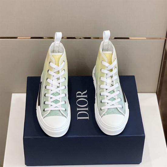 Dior B23 High-Top Trainers Pair Top View in green and yellow Top-down view of pair of Dior B23 green and yellow gradient trainers resting on dark box