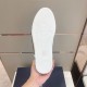 Dior B23 High-Top Trainer Outsole View in green and yellow Underneath view of Dior B23 trainer white patterned rubber outsole in green and yellow
