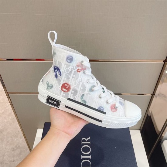 Dior B23 High Top White Printed Oblique Canvas Trainer Hand Profile Hand holding Dior B23 High Top White Printed Oblique Canvas Trainer side profile