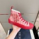 Dior B23 High Top Oblique Red Trainers Handheld View in red and white Dior B23 High Top Oblique Red Trainers single shoe held in hand close-up in red and white