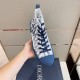 Dior B23 High-Top Oblique Canvas Blue Trainer Handheld View Hand holding Dior B23 High-Top Oblique Canvas Blue Trainer showing upper and laces