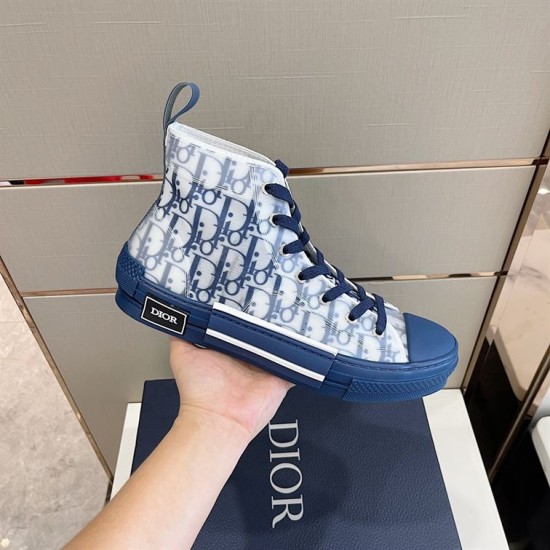 Dior B23 High-Top Oblique Canvas Blue Trainer Held Profile Side profile of Dior B23 High-Top Oblique Canvas Blue Trainer held over box
