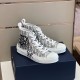 Dior B23 High-Top Trainers Pair View in white and grey Pair of Dior B23 high-top trainers set on blue presentation box in white and grey