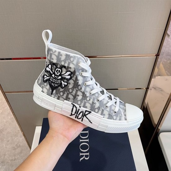 Dior B23 High-Top Trainer Handheld View in white and grey Hand holding single Dior B23 high-top trainer in white and grey monogram