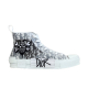 Dior B23 High-Top Trainer Side View in white and grey Dior B23 high-top trainer side view showing white and grey monogram with skull patch