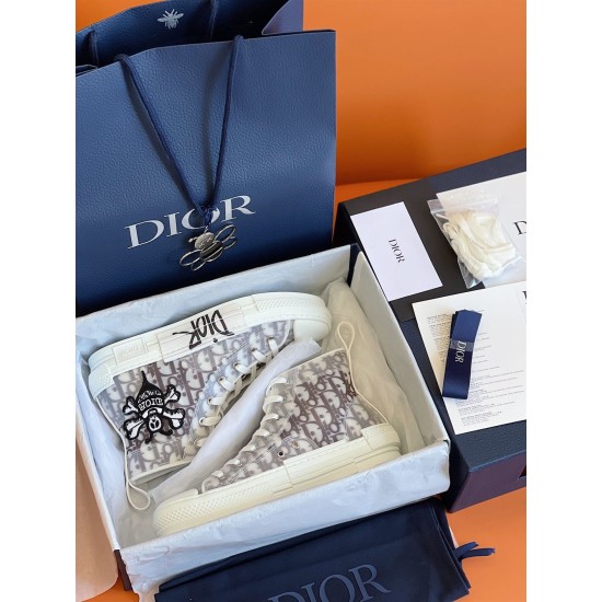 Dior B23 Trainers Packaging View in white and grey Dior B23 trainers presented inside original blue shoe box with accessories in white and grey