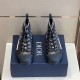 Top-Down Pair View of Dior High-Top Trainers in grey and white Top-down view of pair of dark grey Dior Oblique high-top trainers on navy box in grey and white