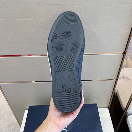 Outsole Sole View of Dior High-Top Trainer in grey and white Bottom outsole view of dark grey Dior trainer showing tread pattern and bee details in grey and white