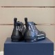 Rear Heel View of Dior Dark Grey High-Top Trainers in grey and white Rear view of dark grey Dior high-top trainers displaying heel counters and pull tabs in grey and white