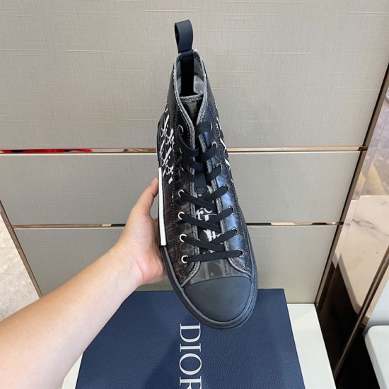 Single Dior High-Top Trainer Front Top View in grey and white Top front perspective of single dark grey Dior high-top trainer held in hand in grey and white