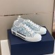 Dior B23 Low Top Oblique Monogram Blue Trainers Three-Quarter View in blue and white Three-quarter angle view of Dior B23 Low Top Oblique Monogram Blue Trainers on box in blue and white