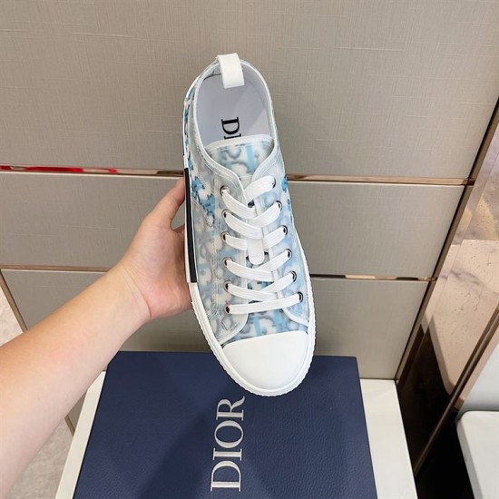 Dior B23 Low Top Oblique Monogram Blue Trainer In Hand in blue and white Top view of a single Dior B23 Low Top Oblique Monogram Blue Trainer held in hand in blue and white