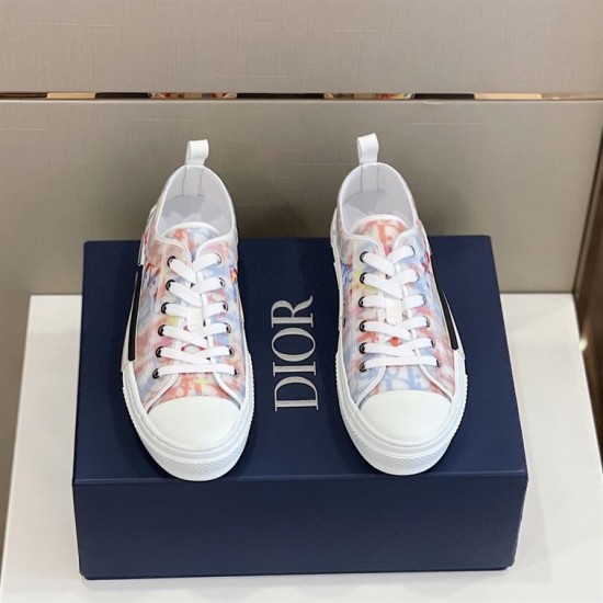 Dior B23 Multicolour Trainers Top View in multicolour and white Top-down view of pair of Dior B23 multicolour low-top trainers placed on a navy box in multicolour and white