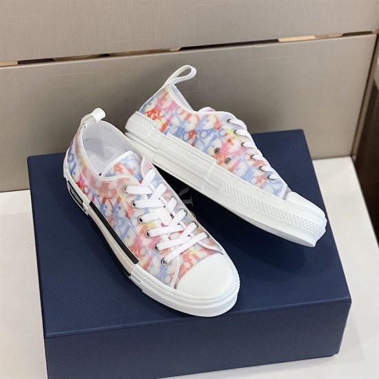 Dior B23 Multicolour Trainers Alternate Angle in multicolour and white Alternate side angle of pair of Dior B23 multicolour trainers on navy box in multicolour and white