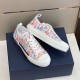 Dior B23 Multicolour Trainers Alternate Angle in multicolour and white Alternate side angle of pair of Dior B23 multicolour trainers on navy box in multicolour and white