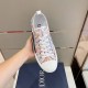 Dior B23 Multicolour Trainer Upper Detail in multicolour and white Handheld top angle view highlighting the white toe cap and multicolour pattern upper of Dior B23 trainer