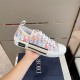 Dior B23 Low-Top Trainer Lateral Detail in multicolour and white Handheld lateral view of Dior B23 multicolour low-top trainer showing midsole inserts in multicolour and white