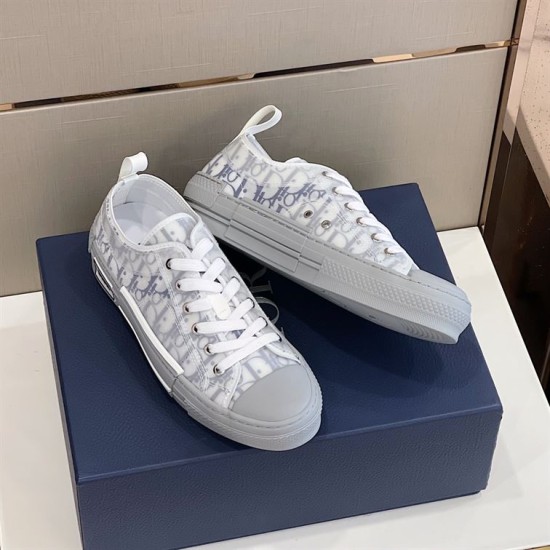 Pair of Dior B23 low-top trainers showing inner medial and outer lateral sides in grey and white
