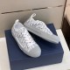 Pair of Dior B23 low-top trainers showing inner medial and outer lateral sides in grey and white