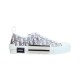 Studio profile shot of white and grey Dior B23 low-top Oblique trainer