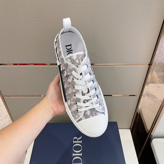 Overhead view of single grey Dior B23 trainer showing lacing and branded footbed in grey and white