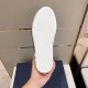 Underside view of white rubber sole on Dior B23 low-top trainer in blue and pink