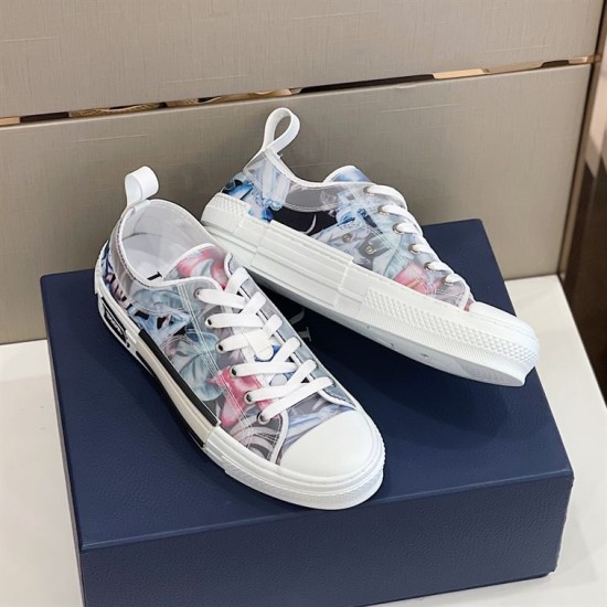 Angled pair view of Dior B23 low-top trainers showing blue and pink printed pattern