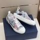 Angled pair view of Dior B23 low-top trainers showing blue and pink printed pattern