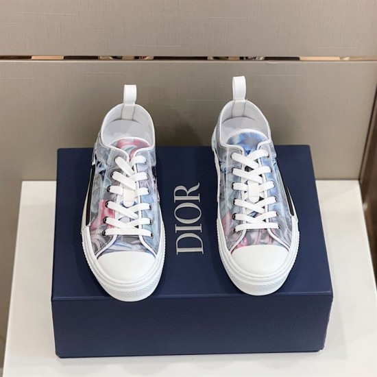 Top-down view of pair of Dior B23 low-top trainers with white laces and blue pink floral upper