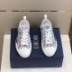 Top-down view of pair of Dior B23 low-top trainers with white laces and blue pink floral upper