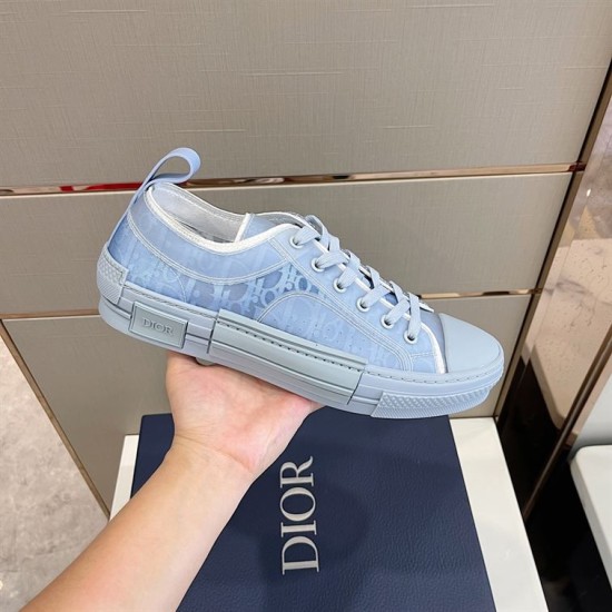 Dior B23 Light Blue Trainer Lateral View in light blue and white Hand holding light blue Dior B23 trainer showing lateral side profile and sole structure in light blue and white