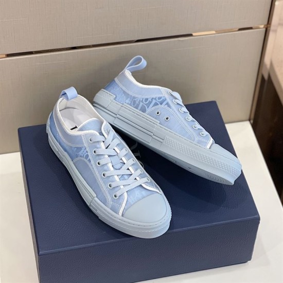 Dior B23 Trainers in Light Blue Canvas in light blue and white Pair of light blue oblique canvas Dior B23 trainers arranged on branded box in light blue and white