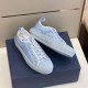 Dior B23 Trainers in Light Blue Canvas in light blue and white Pair of light blue oblique canvas Dior B23 trainers arranged on branded box in light blue and white