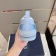 Light Blue Dior B23 Trainer Heel Detail in light blue and white Rear heel view showing pull tab and rubber heel patch of light blue Dior B23 trainer in light blue and white