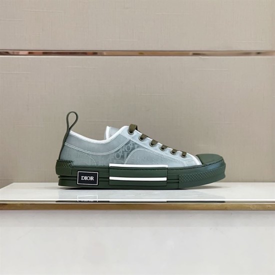 Dior B23 Low Top Trainers Green Oblique Canvas side profile display on a shelf in green and white