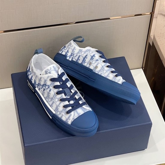 Alternative angled view of Dior B23 blue trainers resting on top of box
