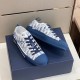 Alternative angled view of Dior B23 blue trainers resting on top of box