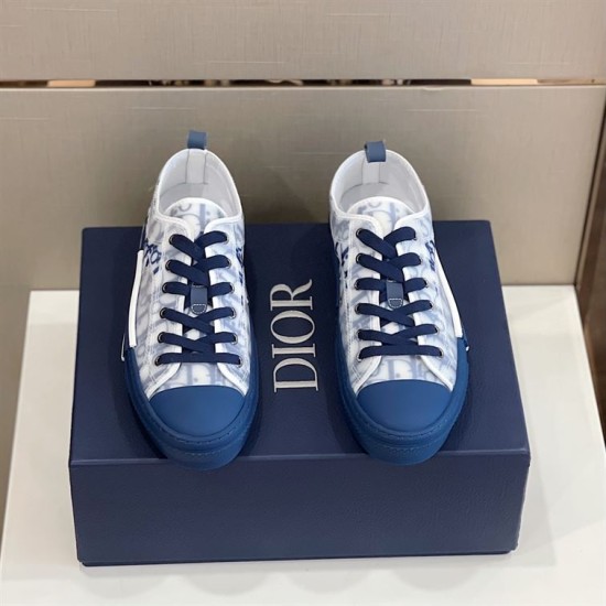 Top-down pair view of Dior B23 low-top trainers sitting on a blue box