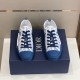 Top-down pair view of Dior B23 low-top trainers sitting on a blue box
